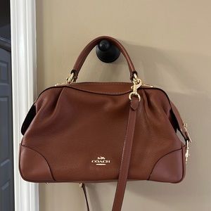Small size coach purse pretty brown color used once or twice looks like new